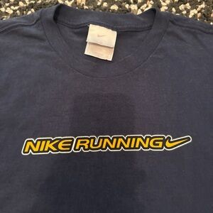 Nike Running Tee in Dark Blue with Yellow Logo